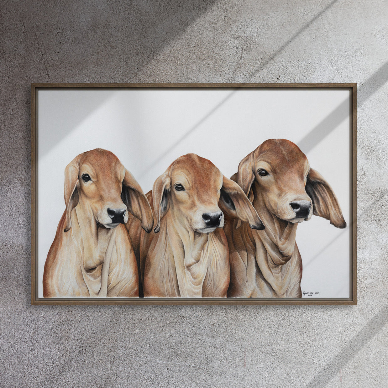 Framed artwork of three calves on a white background