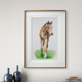 Framed painting of a horse on a wall above a cabinet with decorative items.