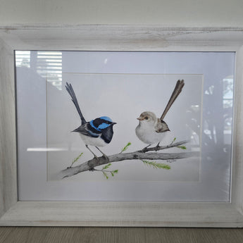 Framed artwork of two birds on a branch
