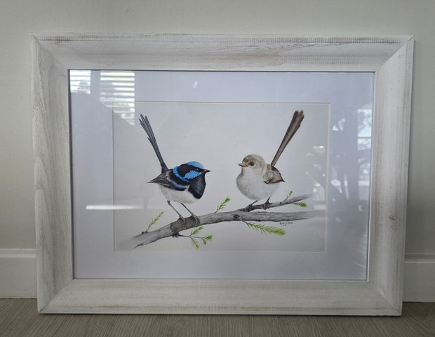 Framed artwork of two birds on a branch