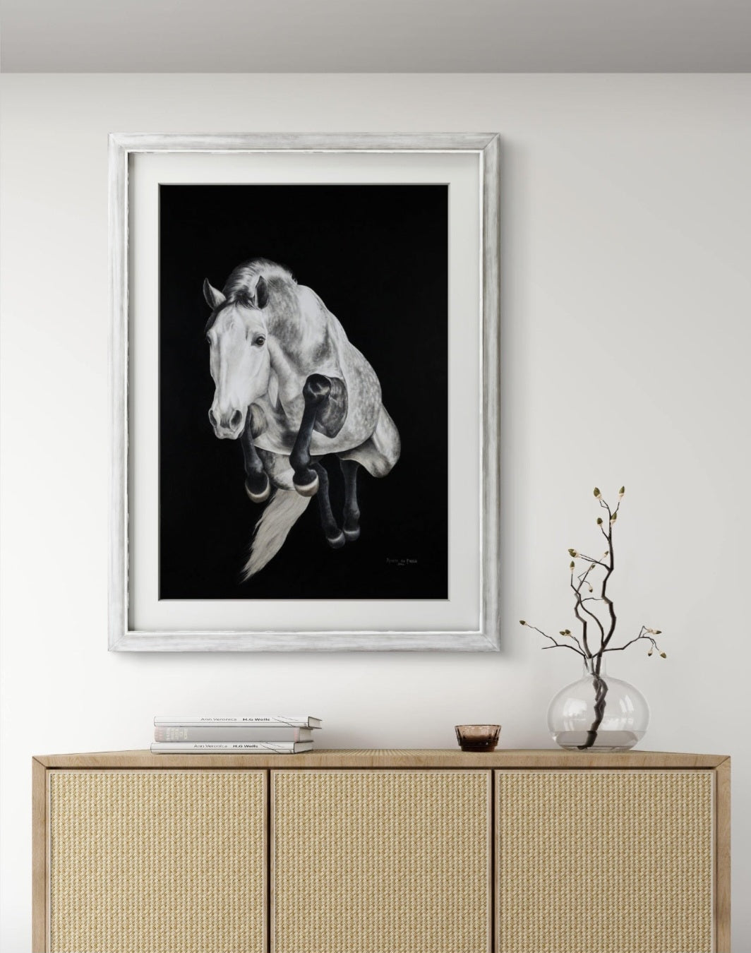 A framing example for the print of the grey horse jumping on a black background