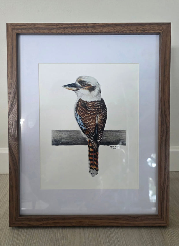 Framed artwork of a kookaburra bird on a branch.