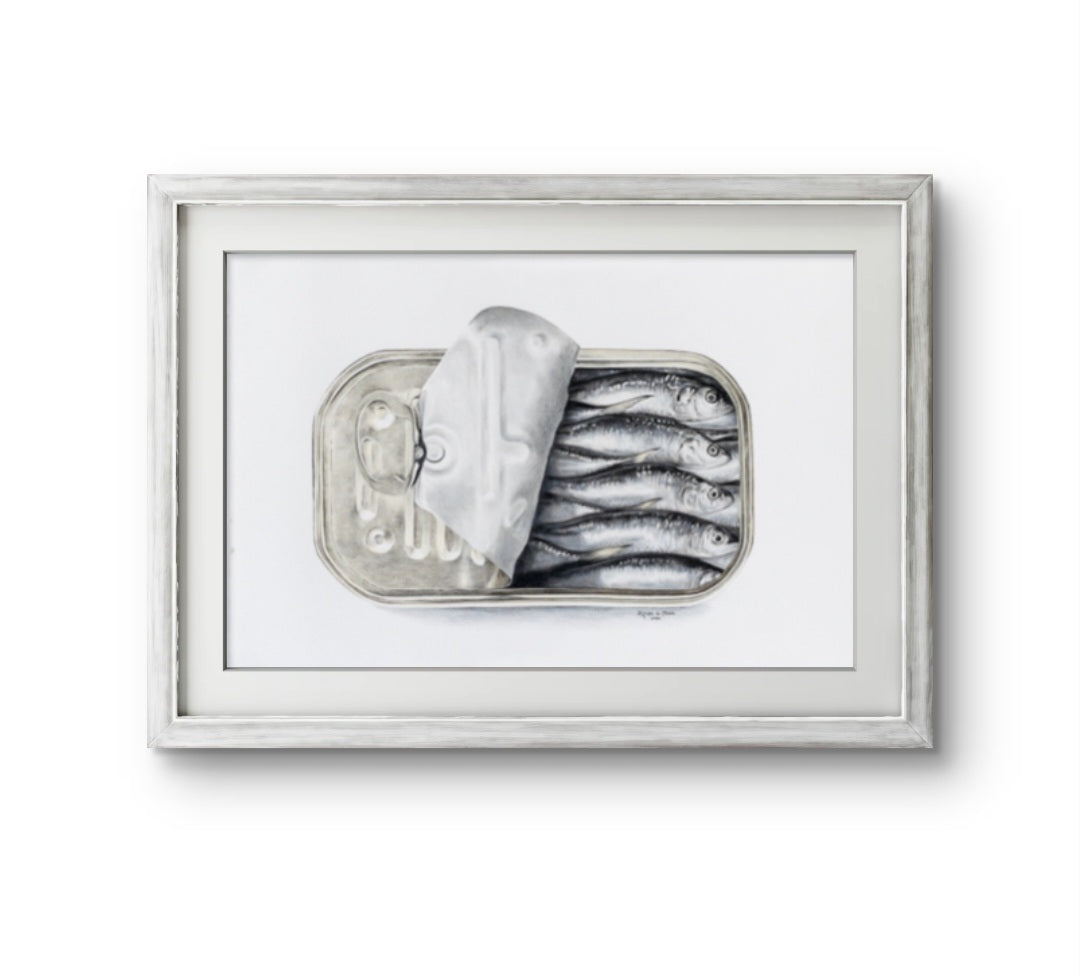 Framed artwork of a still life with a container of fish and a loaf of bread on a white background