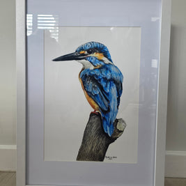 Framed artwork of a blue kingfisher bird on a branch.