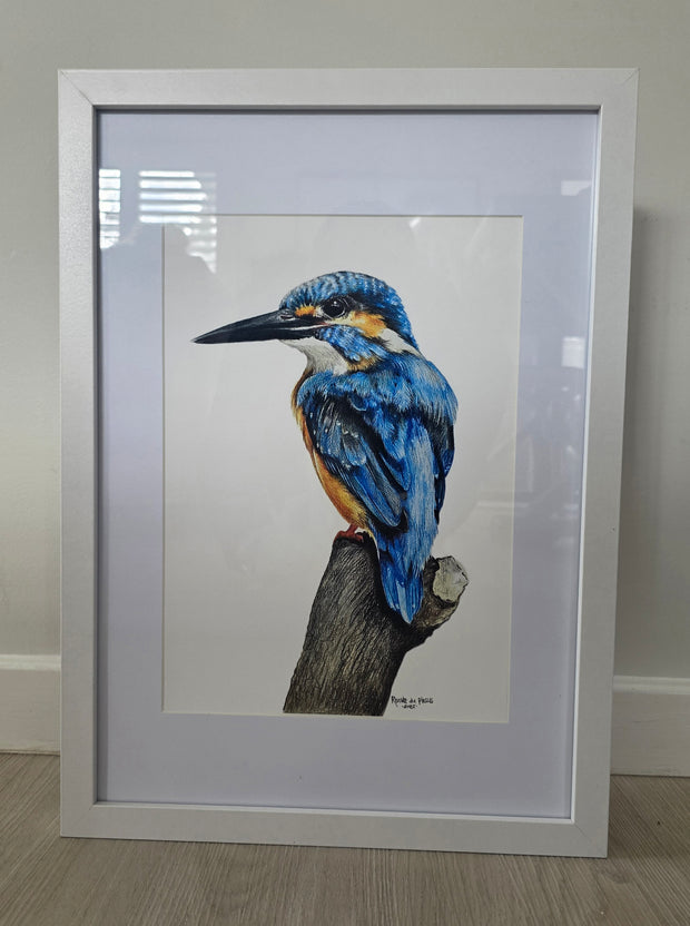 Framed artwork of a blue kingfisher bird on a branch.